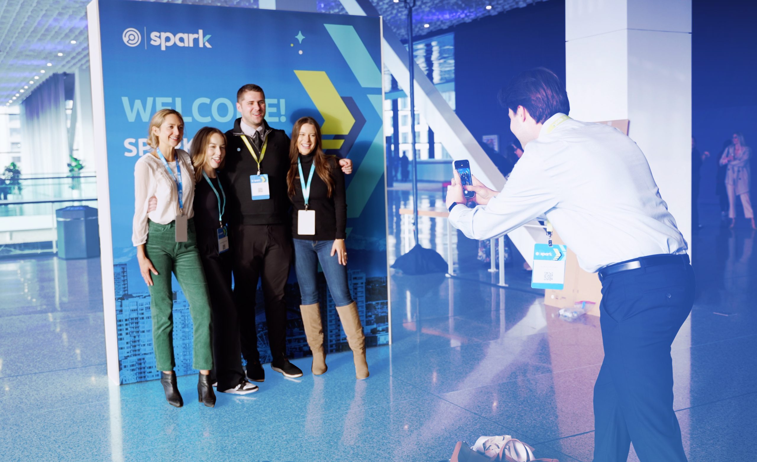 people Standing in front of a Spark sign